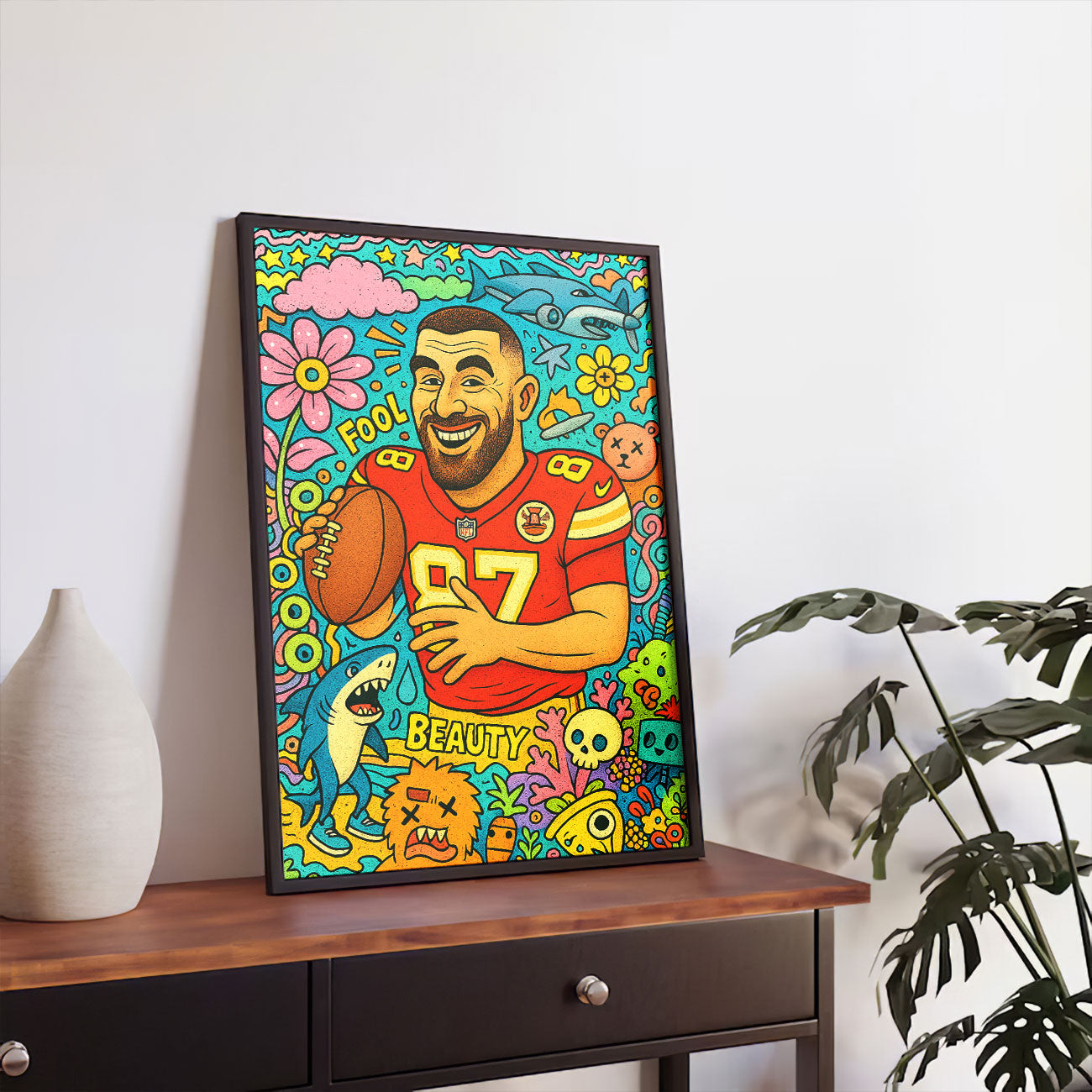 Abstract pop art canvas depicting a smiling male athlete in a red football jersey with number 87, holding a football, surrounded by colorful flowers, clouds, a shark, and whimsical cartoon elements in the style of Dxtr Art