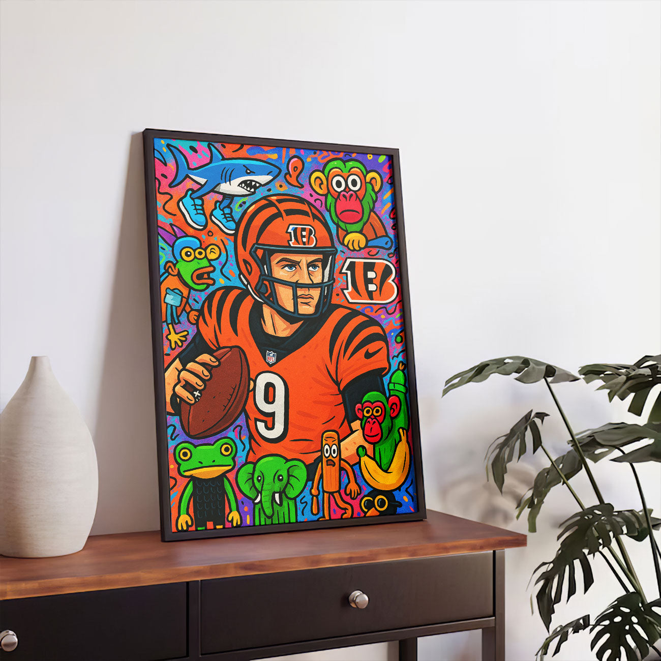 Vibrant pop art canvas print of a football player in an orange and black uniform with number 9, holding a football, surrounded by colorful cartoon monkeys, a shark, and other whimsical animals. 