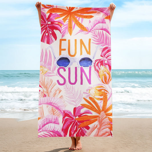 "Fun in the Sun" Tropical Leaves Beach Towel with a white background, vibrant pink and orange tropical leaves, large "FUN IN THE SUN" text, and sunglasses on a beach with ocean background.