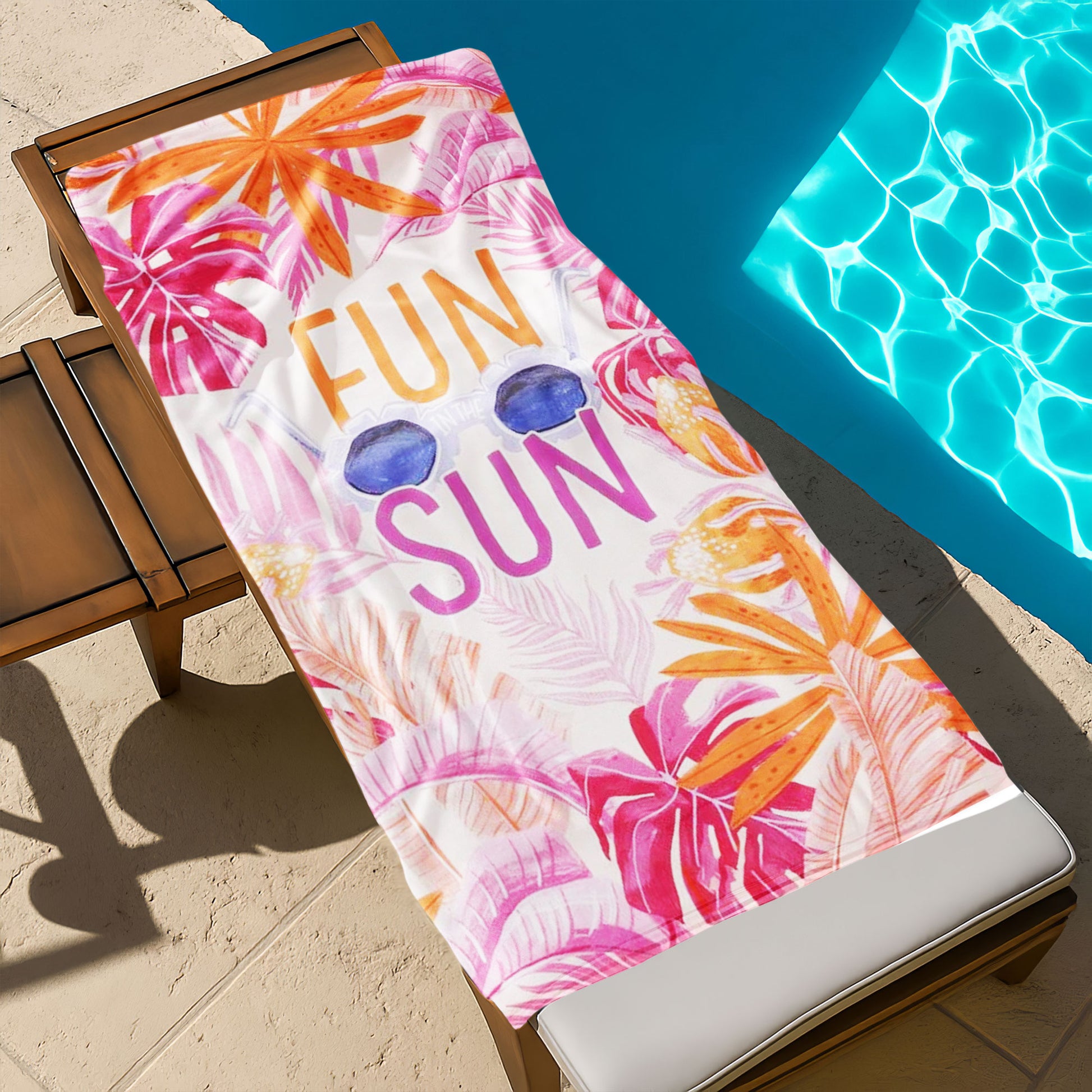 "Fun in the Sun" Tropical Leaves Beach Towel with a white background, vibrant pink and orange tropical leaves, large "FUN IN THE SUN" text, and sunglasses on a beach with ocean background.