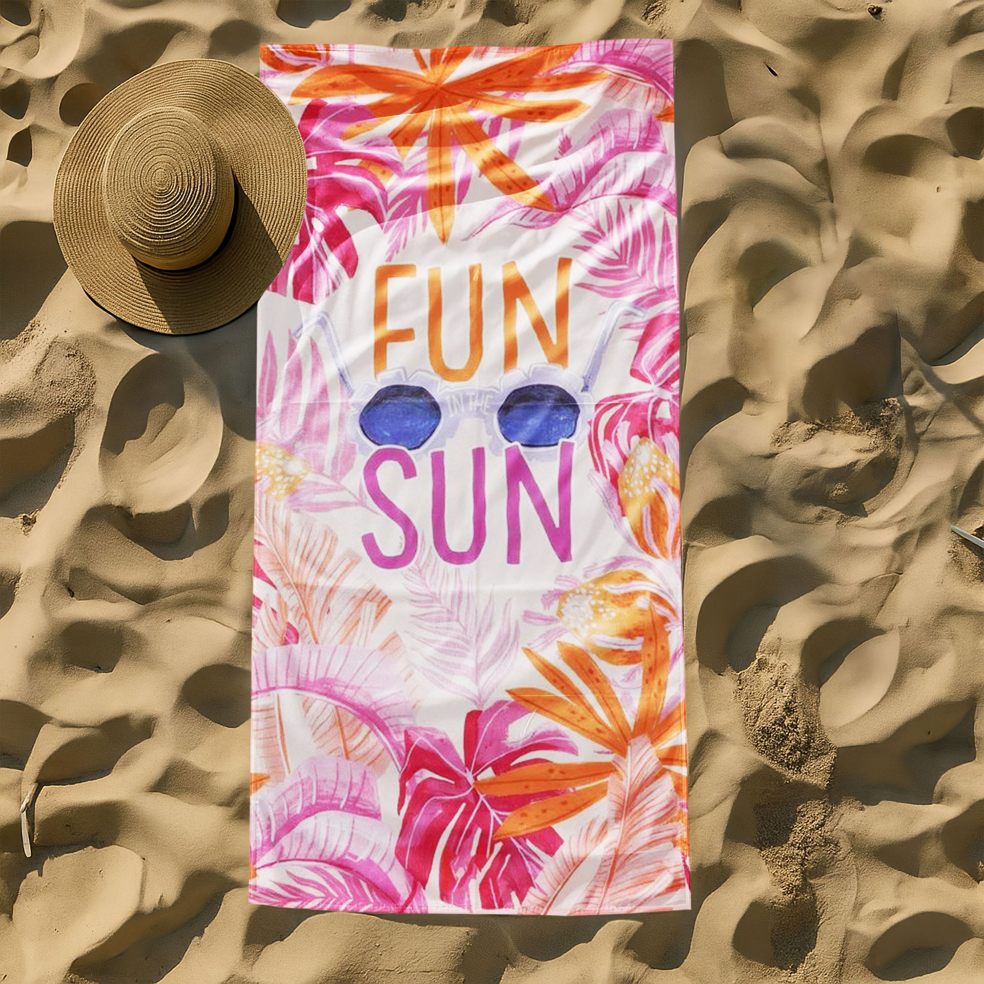 "Fun in the Sun" Tropical Leaves Beach Towel with a white background, vibrant pink and orange tropical leaves, large "FUN IN THE SUN" text, and sunglasses on a beach with ocean background.