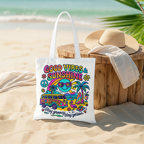 White beach tote bag with a colorful retro design featuring a surf van, palm trees, sun with sunglasses, rainbow, peace sign, and text 'Good Vibes & Sunshine' and 'Stay groovy, stay golden