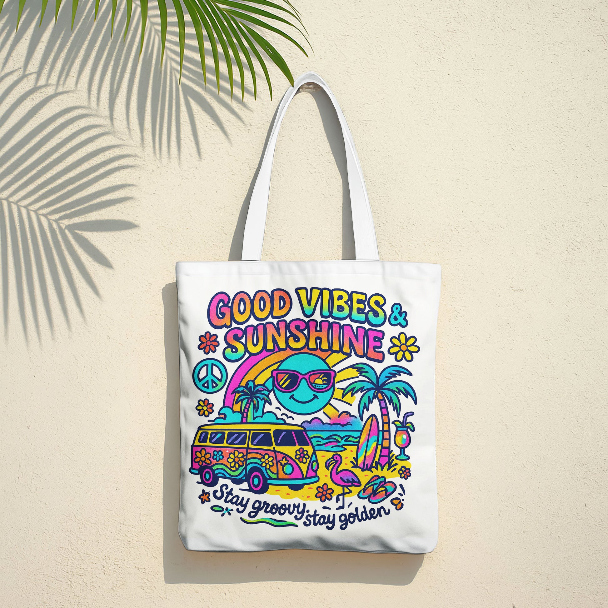 White beach tote bag with a colorful retro design featuring a surf van, palm trees, sun with sunglasses, rainbow, peace sign, and text 'Good Vibes & Sunshine' and 'Stay groovy, stay golden