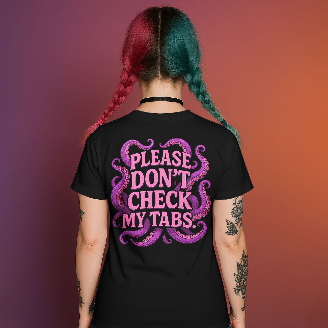 Back of black graphic t-shirt with "PLEASE DON'T CHECK MY TABS." text surrounded by purple and pink tentacles