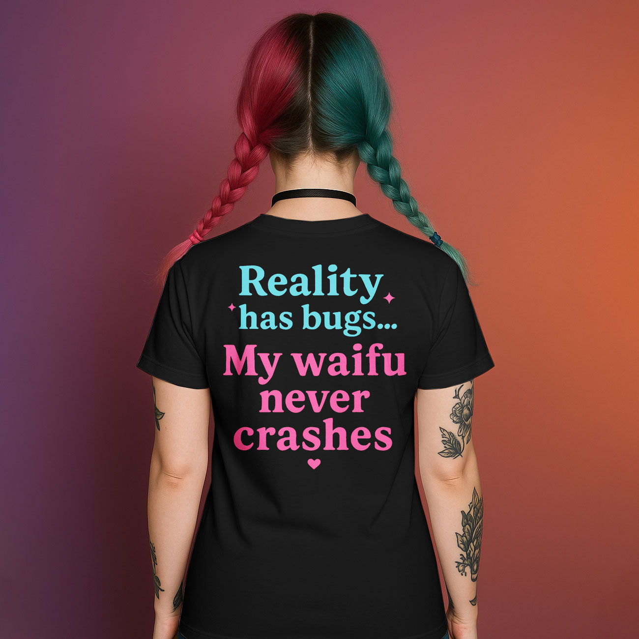 Back of black graphic t-shirt with "Reality has bugs... My waifu never crashes" text in pink and blue
