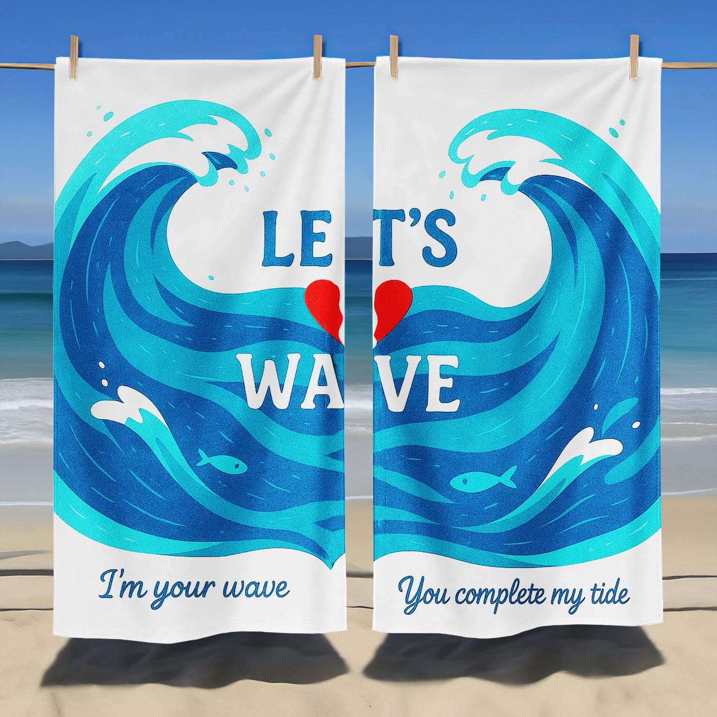 A couple holding up custom white beach towels with large blue wave designs and romantic phrases, "I'm your wave" and "You complete my tide," on a sunny beach.