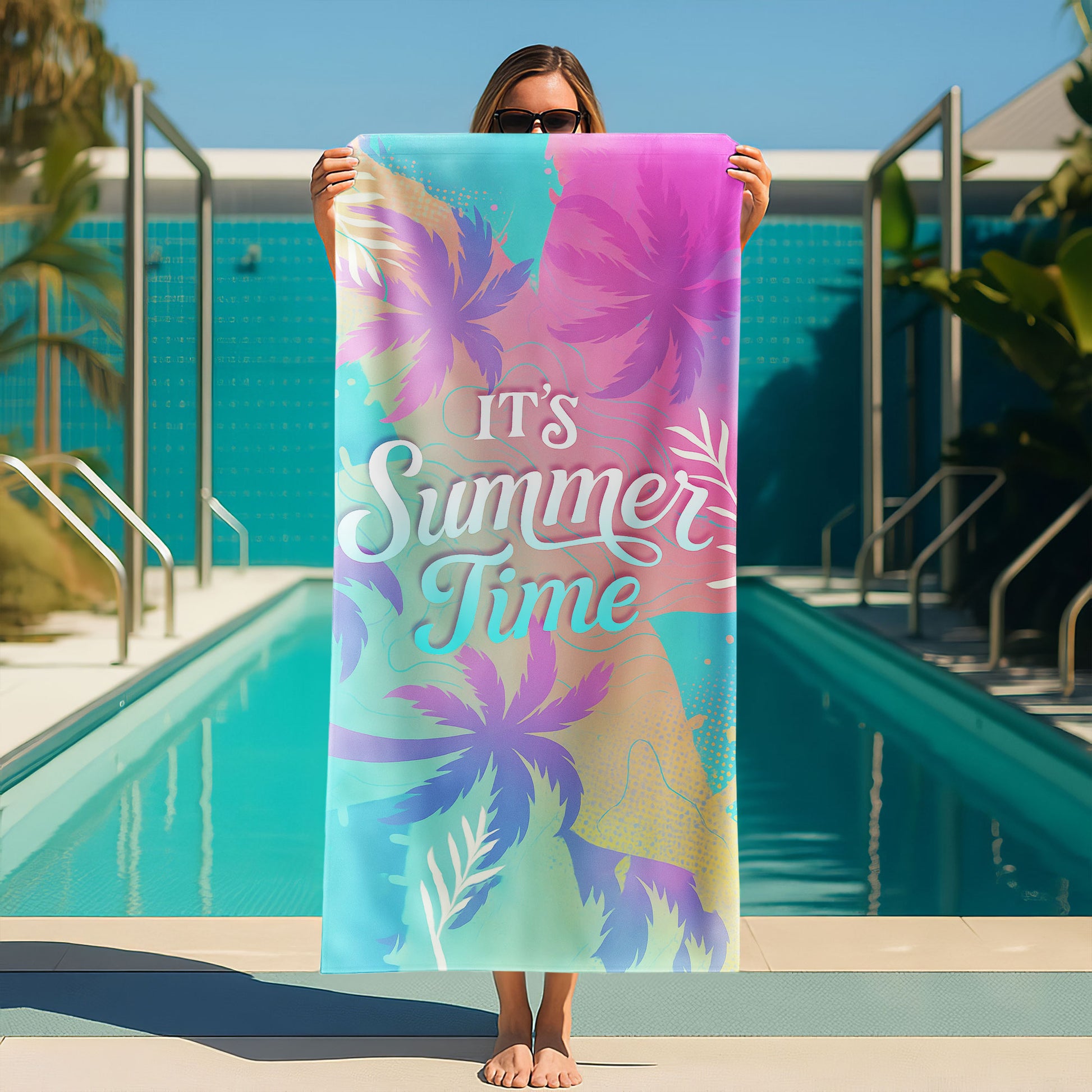 Pastel "It's Summer Time" Beach Towel with a gradient background of pink, blue, and yellow, tropical palm tree silhouettes, and "IT'S Summer Time" text on a beach with ocean background.