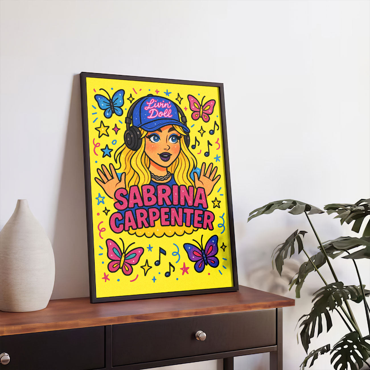 Vibrant pop art print featuring a stylized female pop artist with blonde hair, headphones, and surrounded by butterflies, stars, and musical notes on a yellow background.