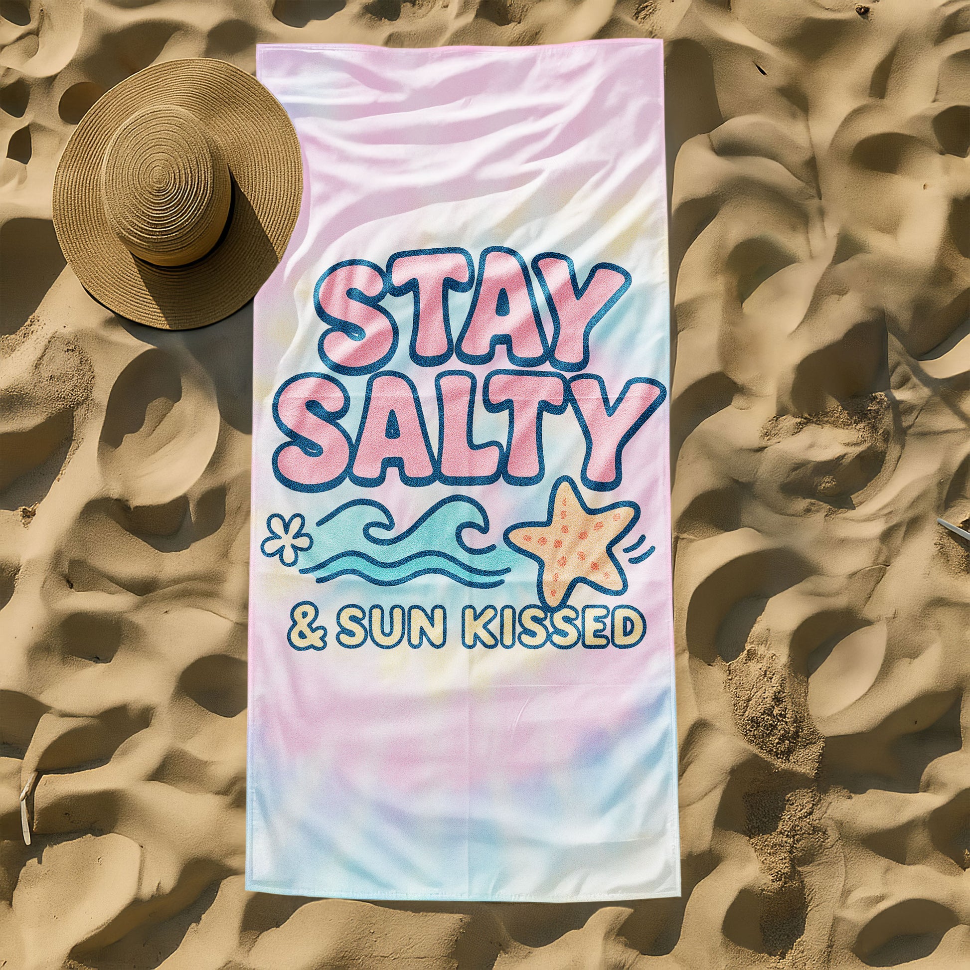 "Stay Salty & Sun Kissed" Tie-Dye Beach Towel with pastel pink, yellow, and blue background, large text "STAY SALTY & SUN KISSED", waves, and a starfish on a beach with ocean background.