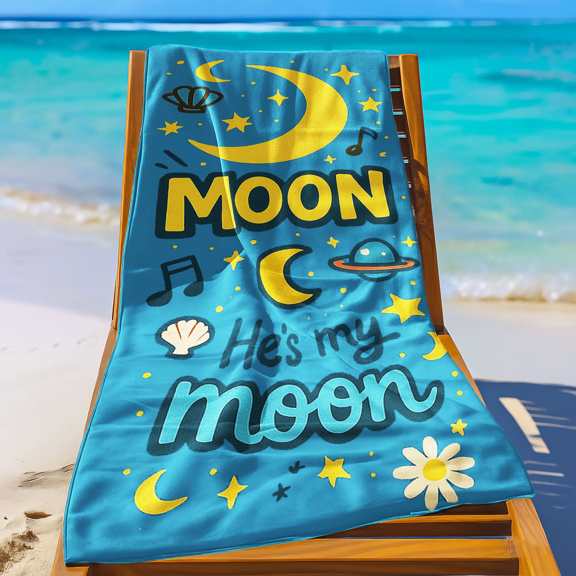 Matching beach towels for couples – one yellow towel with “She’s My Sunshine” and one blue towel with “He’s My Moon” hanging by the beach.