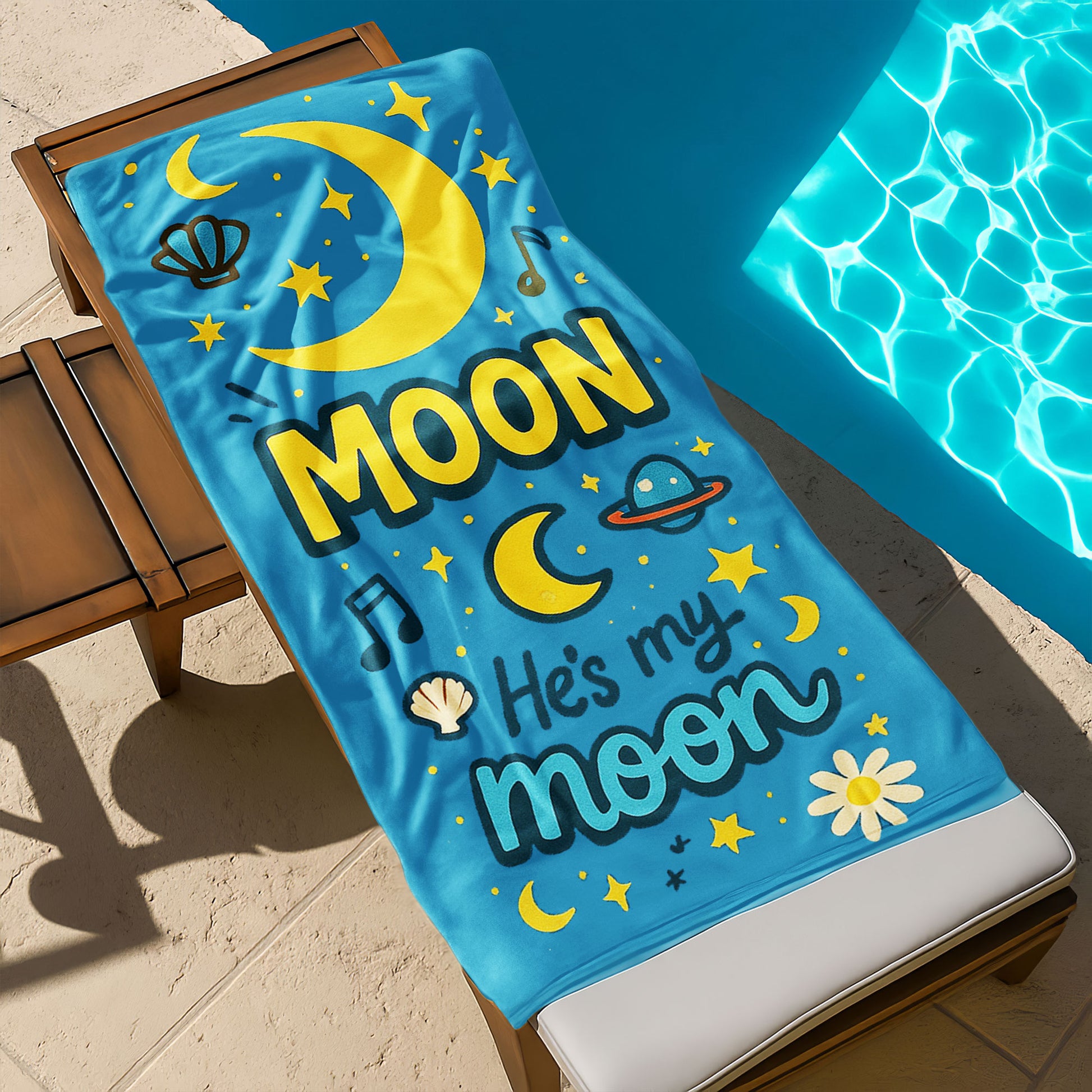 Matching beach towels for couples – one yellow towel with “She’s My Sunshine” and one blue towel with “He’s My Moon” hanging by the beach.

