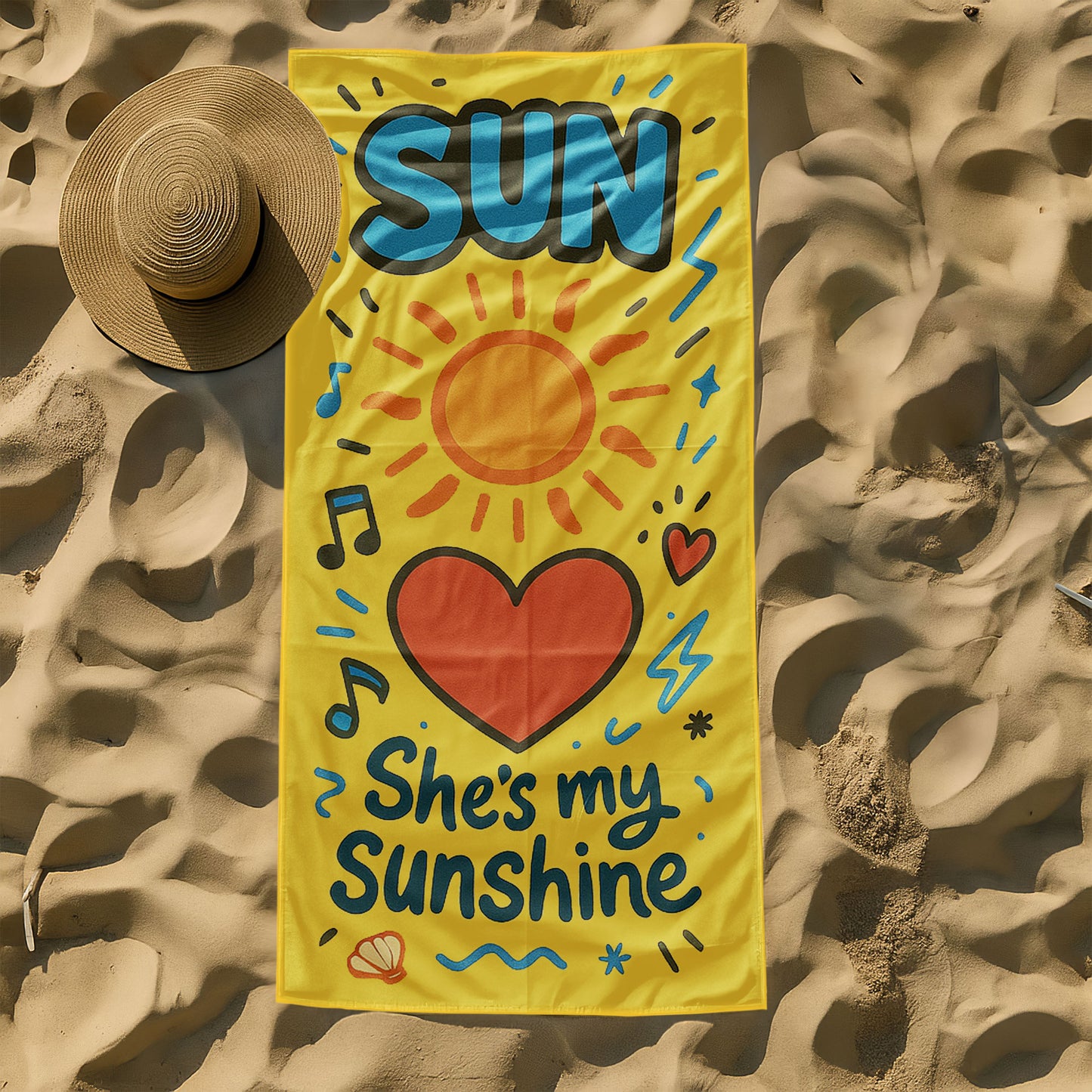 Matching beach towels for couples – one yellow towel with “She’s My Sunshine” and one blue towel with “He’s My Moon” hanging by the beach.
