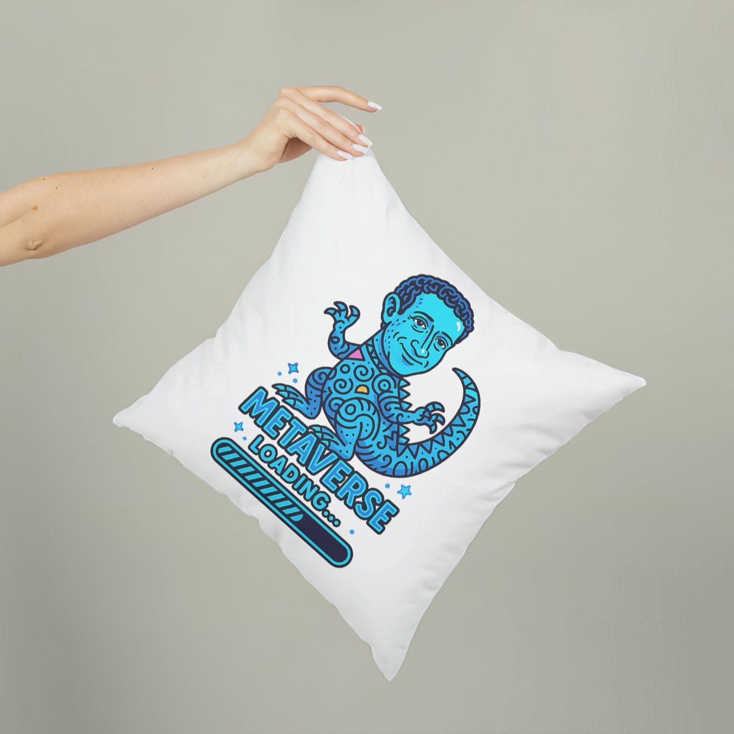White square meme pillow featuring a blue reptilian character with curly hair and large eyes, above "METAVERSE LOADING..." text.
