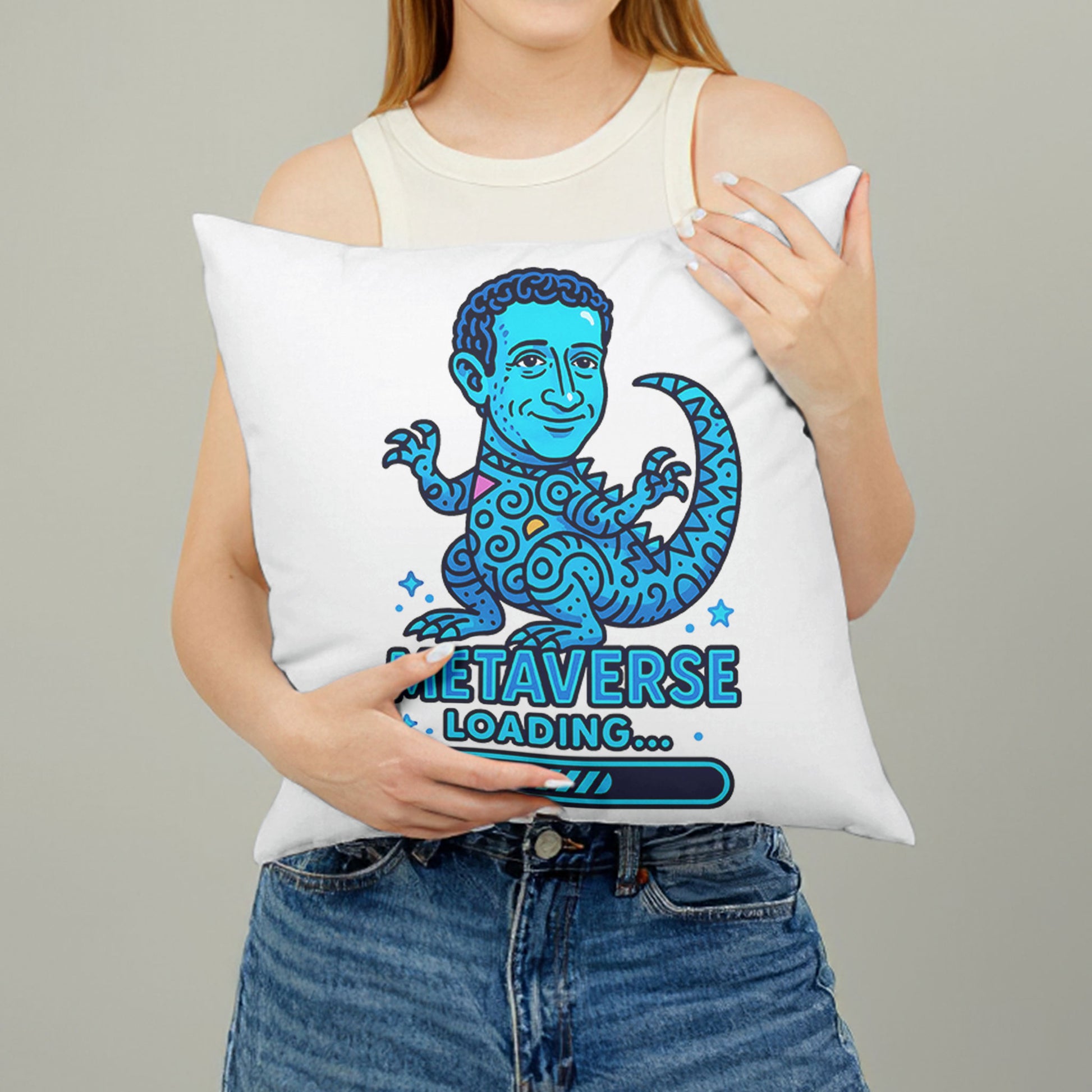 White square meme pillow featuring a blue reptilian character with curly hair and large eyes, above "METAVERSE LOADING..." text.